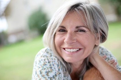 Retired Woman Smiling At Camera